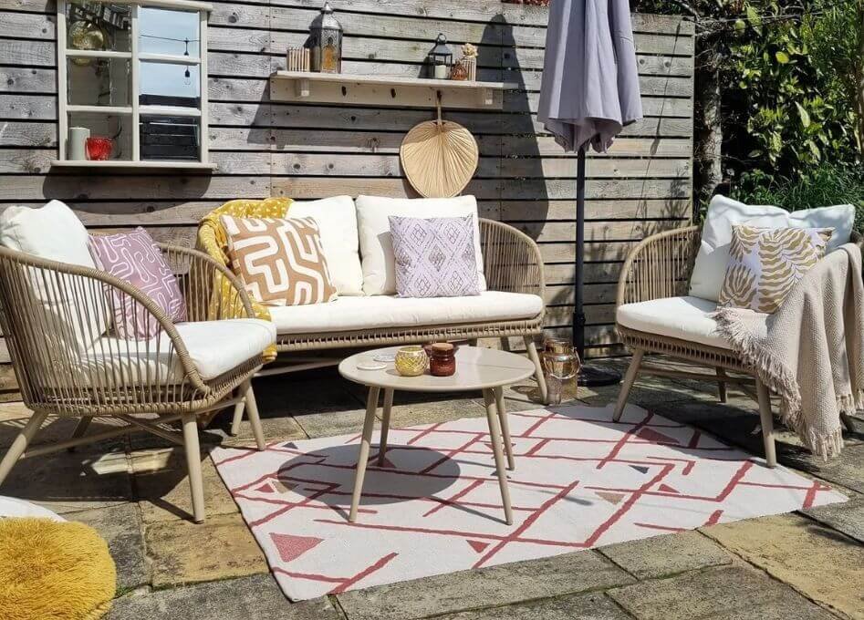 How do outdoor carpets enhance comfort?